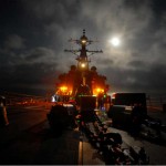 Moonlight illuminates the forecastle aboard the guided missile destroyer USS Cole as Sailors prepare for an early morning replenishment-at-sea. Cole is participating in Exercise Joint Warrior 09-2, a United Kingdom-led, multi-national and multi-warfare exercise designed to improve interoperability between allied navies as well as to prepare for a role in combined operations during upcoming deployments. <br />Credits: Navy Visual News Service , 10/12/09 USS Cole