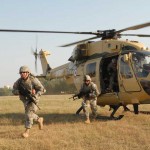 Soldiers from 2nd platoon, Troop A, 2nd Squadron, 14th Cavalry Regiment "Strykehorse," 2nd Stryker Brigade Combat Team, 25th Infantry Division, from Schofield Barracks, Hawaii, exit a helicopter flown by Indian army aviators from the 201st Army Aviation Squadron. The Soldiers were conducting static load training with the Advanced Light Helicopter, an Indian-made helicopter, during Exercise YudhAbyas 09, a bilateral exercise involving the Armies of India and the U.S.<br /><em>Credits: 2nd Stryker Brigade 25th Infantry Division, 10/23/09, Location: CAMP BUNDELA, India</em> US Soldiers Exercise with Indian Army