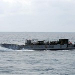 A landing craft utility transports 31st Marine Expeditionary Unit equipment to the amphibious transport dock ship USS Denver (LPD 9). Denver is part of the Denver Amphibious Readiness Group and will participate in three bilateral exercises throughout the western Pacific Ocean during Fall Patrol. Such transports are part of the seabasing capability which we discuss elsewhere on the website. Credit: Navy Visual News Service 9/25/09 Landing Craft Utility Transport