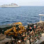 Marines from India Company and Sierra Battery, Battalion Landing Team, 3rd Battalion, 2nd Marine Regiment, 22nd Marine Expeditionary Unit, and Sailors aboard USS Fort McHenry, load supplies on the amphibious dock-landing ship during a vertical replenishment Oct. 2.<br />Credit: 22nd Marine Expeditionary Unit Public Affairs, 10/2/09 USS Fort McHenry