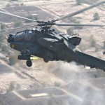 Producing a blast of smoke and fire, an AH-64D Apache attack helicopter pilot from 1st Air Cavalry Brigade, 1st Cavalry Division, fires a 2.75 inch hydra aerial folding-fin rocket while conducting a gunnery operation the outskirts of Baghdad, Gunnery training and operations are crucial for ground support. As a brigade combat team closes with the enemy and brings its firepower to bear, leaders must focus on hitting enemy targets while avoiding fratricide and limiting unnecessary collateral damage. The techniques of fire distribution and knowledge of combat identification are central to doing this effectively.<em>Credit: Multi-National Division Baghdad, 11/9/09, Location: Baghdad Iraq</em> Apache in Iraq