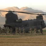 Soldiers of the joint force board the CH-47 after checking locations of known militant activity and recovering munitions caches in Zanakhan District, Ghazni Province, Afghanistan.<em>Credit: 55th Combat Camera, Photo by Spc. Walter Reeves, 10/31/09, Location: Zanakhan District, Afghanistan</em> Boarding CH-47