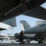 A plane captain cleans an F/A-18C Hornet assigned to the Dambusters of Strike Fighter Squadron 195 aboard the aircraft carrier USS George Washington. George Washington, the Navy's only permanently forward-deployed aircraft carrier, is underway supporting security and stability in the western Pacific Ocean.<br /><em>Credits: USN Visual Service, 10/17/09</em> Cleaning an F-18