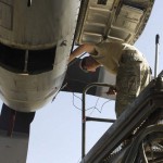 Senior Airman Gregory Hovore, crew chief from the 455th Expeditionary Aircraft Maintenance Squadron, inspects the propeller of the C-130 Hercules to make sure the aircraft has enough power for its mission Nov. 21. With the ability to take off and land on dirt or rough landing strips, the Hercules is used to move troops and equipment into hostile areas. Hovore, a Reno, Nev. native, is deployed from the Nevada Air National Guard's 152nd Aircraft Maintenance Squadron. <br /><em>Credit: 455th Air Expeditionary Wing, 11/21/09, Location: Bagram Airfield, Afghanistan</em> Cleaning a C130
