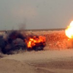 U.S. Soldiers, assigned to Echo Company, 1st Battalion, 8th Cavalry, 2nd Brigade Combat Team, 1st Cavalry Division, help set charges with Iraq soldiers, to detonate unexploded ordinance in Gaines Mills, Iraq, Oct. 27, 2009.<em>Credit: 55th Combat Camera, 10/27/09, Location: Gaines Mills, Iraq</em> Detonating Unexploaded Ordinance in Iraq