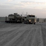296th Transportation Co. from Brookhaven, Miss. practices maneuvering their Heavy Equipment Transporter, carrying a Mine Resistant Ambush Protected vehicle. The 296th TC, 260th Combat Sustainment Support Battalion, 96th Sustainment Brigade, 13th Sustainment Command (Expeditionary), carries various types of cargo throughout the Baghdad area of operations and must continually refine their driving skills. <br /><em>Credit: 13th Sustainment Command (Expeditionary), 12/14/09, Location: CAMP LIBERTY, Iraq</em> Heavy Equipment Transporter in Iraq