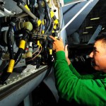 Aviation Electronics Technician 3rd Class Randy Whitehorse troubleshoots equipment on an F/A-18C Hornet assigned to the Sidewinders of Strike Fighter Squadron (VFA) 86 aboard the aircraft carrier USS Nimitz (CVN 68). The Nimitz Carrier Strike Group is on a routine deployment in the U.S. 5th Fleet area of responsibility.<em>Credit: USS NIMITZ, 11/11/09, Location: GULF OF OMAN, At Sea</em> Maintainence of F18