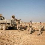 Marines with Multi National Force - West load scrap metal into the back of a seven ton truck aboard Al Asad Air Base, Iraq. Though some remnants of war will always remain a part of the scenery aboard Al Asad, Marines are working hard to ensure future units, either U.S. or Iraqi, inherit a fresh start.<br /><em>Credit: II Marine Expeditionary Force (Fwd), 11/22/09</em> Operation Blue Spoon