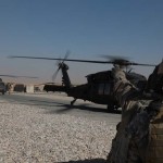 U.S. Army Soldiers, assigned to 318th Psyop Company, prepare to board a Black Hawk helicopter in Logar Province, Afghanistan, October 23, 2009. The mission's objective was drop 20,000 psyop leaflets in Kherwar, Afghanistan.<em>Credit: Combined Joint Task Force - 82 PAO, 10/24/09, Location: Logar Province, AF</em> Psyop Operation