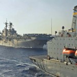 The amphibious assault ship USS Bataan pulls alongside the Military Sealift Command fleet replenishment oiler USNS Kanawha to conduct a replenishment-at-sea. Bataan is the lead ship of the Bataan Amphibious Ready Group and is supporting maritime security operations in the U.S. 5th Fleet area of responsibility.<em>Credit: US Navy Visual News Service, Photo by Seaman Ash Severe, 10/16/09, Location: USS Bataan, At Sea</em> Replenishment of USS Bataan At Sea