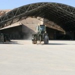 A worker drives a forklift through the new Marine Corps Logistics Command (Forward) lot, which opened aboard Al Asad Air Base, Iraq, Dec. 1. The lot will be the drop off point for all gear being turned in for the rdrawdown by Marines in the Al Anbar province. The new lot is significantly smaller than the previous one at Taqaddum, but with less gear to turn in, the space is no longer necessary. "When we first got out here, there were about 380,000 pieces of gear needing to be retrograded," one Marine. "Now we're down to about 21,000." <br /><em>Credit: http://www.dvidshub.net/?script=general/general_search.php&table=news&query=unit:518: II Marine Expeditionary Force (Fwd), 12/3/09</em> Retrograde Lot