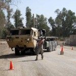 Sgt. Ryan Gandolfo, from Los Angeles, Calif., a truck driver with the 396th Transportation Company, 260th Combat Sustainment Support Battalion from Fort Stewart, Ga., guides a Palletized Load System truck through a serpentine course during a training day on Victory Base Complex, Iraq.<em>Credits: 13th Sustainment Command (Expeditionary), 10/27/09, Location: Camp Liberty, Iraq</em> Sustainment Operation