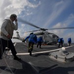 Sailors aboard the guided-missile destroyer USS Cole use chocks and chains to secure an SH-60 Sea Hawk helicopter assigned to the Vipers of Helicopter Anti-Submarine Squadron Light 48 to the deck during flight quarters. Cole is scheduled to participate in Exercise Joint Warrior 09-2, a United Kingdom-led, multi-national and multi-warfare exercise designed to improve interoperability between allied navies as well as to prepare for a role in combined operations during upcoming deployments. <br /> Credit USN Visual Service 10/2/09 Aboard the guided-missile destroyer USS Cole