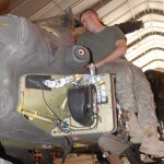 Army Pfc. Bradley McGuirk, an AH-64 attack helicopter repairer from Company D, 3rd Battalion, 101st Aviation Regiment, 101st Airborne Division (Air Assault), works on an AH-64D Apache Longbow attack helicopter's weapons systems at Forward Operating Base, Salerno, Aug 13, 2009. The Apache helicopter is undergoing its mandatory 500 hour inspection, which the helicopter is taken apart and thoroughly inspected to make sure it is safe to fly. <br />Credit 5th Mobile Public Affairs Detachment 8/13/09 AH-64 attack helicopter repairer
