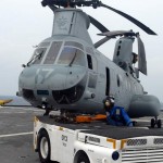 Sailors position a Marine Corps CH-46 helicopter during flight operations aboard amphibious dock landing ship USS Tortuga. Tortuga and USS Harpers Ferry are supporting humanitarian assistance operations at the request of the Republic of Philippines in the wake of Typhoon Ketsana. <br />Credit USN Visual Service 10/4/09 Marine Corps CH-46 helicopter