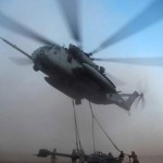 USMC airlifts newest howitzers in historic first of airlift of howitzer package over significant distance. U.S. Marines with Combat Logistics Battalion 8 attach an M777A2 Lightweight Howitzer to a CH-53E Super Stallion at the helicopter landing zone here Sept. 28, 2009. The Marines transported three howitzers over 75 miles to support 2nd Battalion, 3rd Marine Regiment's operations in neighboring Nimruz province. <br />Credit: USMC regimental combat team 3 9/28/09 M777A2 Lightweight Howitzer