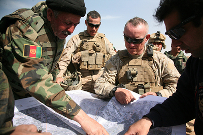 General Nicholson briefed US Marine Brigadier General Larry Nicholson is briefed by Afghan Colonel Ghullam Dastagir on the western edge of Marjah, in central Helmand, moments before a Taleban rocket screamed overhead (Credit: Jerome Starkey, www.flickr.com)