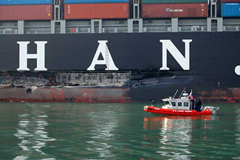 Cosco Busan The Cosco Busan anchored in San Francisco Bay after striking the Bay Bridge on the foggy morning of Nov. 7, 2007 (Credit Photo: International Bird Rescue Research Center; www.ibrrc.org)