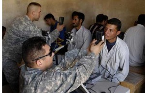 Army Sgt. Timothy Box and Cpl. Ben Webber use the Biometrics Automated Tool Set system to hold information on the volunteers who sign up to become security guards in Taji, Iraq (Credit Photo: Senior Airman Steve Czyz, U.S. Air Force/DoD) Army Sgt. Timothy Box and Cpl. Ben Webber use the Biometrics Automated Tool Set system to hold information on the volunteers who sign up to become security guards in Taji, Iraq (Credit Photo: Senior Airman Steve Czyz, U.S. Air Force/DoD)