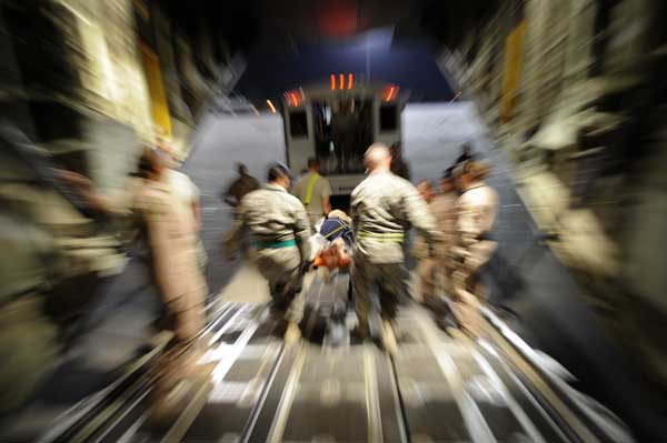 U.S. Air Force Airmen, assigned to the 451st Expeditionary Aeromedical Evacuation Flight, transport patients from a C-130J Super Hercules to an ambulance during an Aeromedical Evacuation mission to transport patients from Camp Bastion to Bagram Air Base (Credit: USAF 06/19/2010) U.S. Air Force Airmen, assigned to the 451st Expeditionary Aeromedical Evacuation Flight, transport patients from a C-130J Super Hercules to an ambulance during an Aeromedical Evacuation mission to transport patients from Camp Bastion to Bagram Air Base (Credit: USAF 06/19/2010)