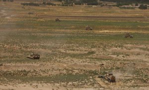 SHUKVANI, Helmand province, Afghanistan - The Republic of Georgia’s 33rd Light Infantry Battalion provides a security cordon around the Ladar Bazaar as an assault breaching vehicle with 2nd Combat Engineer Battalion moves into position. Second CEB cleared the marketplace of the IED threat that plagued the local residents. (Credit: 2nd Marine Division) SHUKVANI, Helmand province, Afghanistan - The Republic of Georgia’s 33rd Light Infantry Battalion provides a security cordon around the Ladar Bazaar as an assault breaching vehicle with 2nd Combat Engineer Battalion moves into position. Second CEB cleared the marketplace of the IED threat that plagued the local residents. (Credit: 2nd Marine Division)