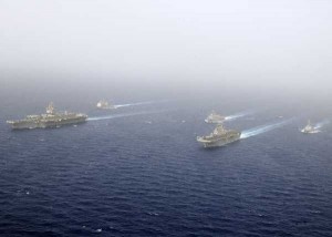 Ships of the Kearsarge Amphibious Ready Group and the Enterprise Carrier Strike Group steam in close formation for a scheduled photographic exercise known as a PHOTOEX. (Credit: USN Visual Service 2/16/2011) Ships of the Kearsarge Amphibious Ready Group and the Enterprise Carrier Strike Group steam in close formation for a scheduled photographic exercise known as a PHOTOEX. (Credit: USN Visual Service 2/16/2011)