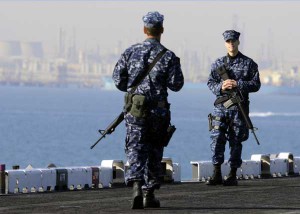 Aviation Support Equipment Technician 3rd Class Jack Strickland, left, and Aviation Ordnanceman Airman Josh Goodrich stand roving security watch on the flight deck as amphibious assault ship USS Kearsarge (LHD 3) approaches Ash Shuaybah, Kuwait. (Credit: USN Visual Service) Aviation Support Equipment Technician 3rd Class Jack Strickland, left, and Aviation Ordnanceman Airman Josh Goodrich stand roving security watch on the flight deck as amphibious assault ship USS Kearsarge (LHD 3) approaches Ash Shuaybah, Kuwait. (Credit: USN Visual Service)