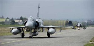 Two Mirage 2000s are seen preparing to depart the main airbase in Dijon for a Libyan strike. (Credit: http://www.lexpress.fr/actualites/2/actualite/une-quinzaine-d-avions-francais-deployes-dimanche-en-libye_974323.html) Two Mirage 2000s are seen preparing to depart the main airbase in Dijon for a Libyan strike. (Credit: http://www.lexpress.fr/actualites/2/actualite/une-quinzaine-d-avions-francais-deployes-dimanche-en-libye_974323.html)