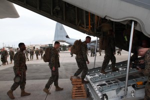 Marines board a KC-130J Hercules aircraft Nov. 10 at Marine Corps Air Station Futenma, Okinawa, Japan, moments before departing for a humanitarian assistance and disaster relief mission to the Philippines. (Photo by Lance Cpl. David N. Hersey)