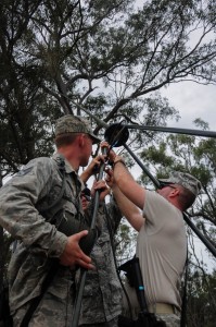Airmen from the 36th Mobility Response Squadron set up an AN/PSC-5D Multi-Band, Multi-Mission Radio System at the airfield entry control point July 22 during Talisman Saber 2013 at Williamson Airfield. The 36th MRS is part of the 36th Contingency Response Group (CRG), Andersen Air Force Base, Guam. The 36th CRG assumed command and control of the airfield from the 1st Battalion, 501st Parachute Infantry Regiment, 4th Brigade Combat Team, 25th Infantry Division (Airborne) and turned over command to the Royal Australian Air Force as part of a multiphase combined-joint operation.Talisman Saber was designed to utilize a realistic scenario to train U.S. and Australian forces in planning and executing combined and joint military operations on land, air and sea. (U.S. Air Force photo by Airman 1st Class Marianique Santos/Released)