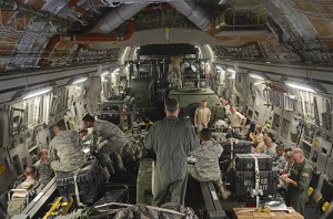 Airmen from the 36th Contingency Response Group and 535th Airlift Squadron situate their luggage and themselves on their seats Nov. 15, 2013, on the Andersen Air Force Base, Guam, flightline before the aircraft departs to support Operation Damayan in Tacloban, Philippines. Operation Damayan is a U.S. humanitarian aid and disaster relief effort to support the Philippines in the wake of the devastating effects of Typhoon Haiyan. (U.S. Air Force photo by Senior Airman Marianique Santos/Released)