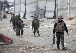 Forces loyal to Syria's President Bashar al-Assad walk with their weapons in the Aleppo town of Naqaren, after claiming to have regained control of the town, January 13, 2014. REUTERS/George Ourfalian. Russia has provided crucial arms lifeline to Assad.