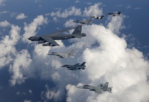 Aircraft from the U.S. Air Force, U.S. Navy, Japan Air Self-Defense Force, and Royal Australian Air Force fly in formation over the Pacific Ocean in support of exercise Cope North 2013, Andersen Air Force Base, Guam, Feb. 5, 2013. During this event, the aviators trained on war-fighting integration tactics. Cope North is a multilateral aerial and humanitarian assistance and disaster relief exercise, held annually, designed to increase the combat readiness and interoperability of the U.S. military, JASDF, and RAAF. (Courtesy photo/Jim Haseltine/Released)