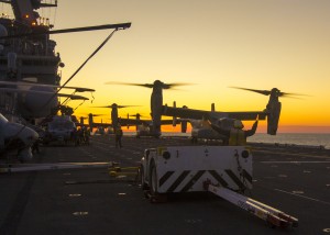 Marines and Sailors assigned to Maritime Raid Force, 26th Marine Expeditionary Unit (MEU), embark from the USS Kearsarge (LHD 3), at sea, on MV-22B Ospreys assigned to Marine Medium Tiltrotor Squadron (VMM) 266 (Reinforced), for a simulated night raid, Feb. 09, 2013. (U.S. Marine Corps photo by Cpl. Kyle N. Runnels/Released)