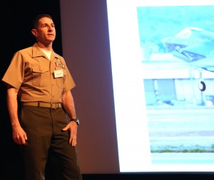 Lt. Col. "Chip" Berke discussing his F-22 and F-35 experiences with the Australian audience at the Williams Foundation Conference, March 11, 2014. Credit Photo: SLD