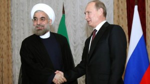 anian President Hassan Rouhani (L) shakes hands with his Russian counterpart Vladimir Putin in Bishkek. (Iranian TV file photo).
