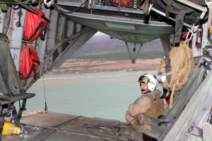 Marine assigned to Marine Medium Tiltrotor Squadron (VMM) 166 mans the rear cargo hatch during a flight over Camp Lemonnier and surrounding area. Credit: Camp Lemonnier, Djibouti, 11/12/13.