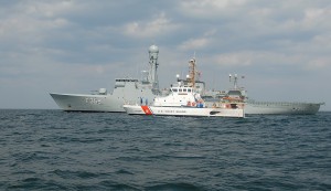 The crew of Coast Guard Cutter Tiger Shark, home-ported in Newport, R.I., pulls alongside the Vaedderen, a Royal Danish Naval ship, in Cape Cod Bay, Mass., March 26, 2008. The Tiger Shark hosted the Royal Danish Navy for a damage control exercise as part of a two-day exercise to enhance teamwork between the Coast Guard and Royal Danish Navy. USCG District 1, 10/21/07