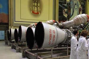 Energomash company employees stand near RD-180 engines prepared for shipment to the United States in a shop at the Energomash, leading Russian rocket engine company, in Moscow, Thursday, June 6, 2002. Energomash and U.S. company Pratt & Whitney have created a joint venture to build and test the RD-180 engine. The engine has successfully flown twice as the first stage engine of Lockheed Martin's Atlas 3 rocket. Credit Photo: US News and World Report
