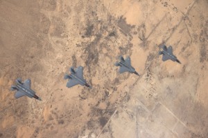 Test pilots from the F-35 Integrated Test Force at Edwards AFB, California, conducted the first multi-ship flight with all three F-35 variants during a test mission to evaluate the F-35’s Multifunction Advanced Data Link, or MADL. Four F-35s exchanged information during the flight—two F-35As, one F-35B, and one F-35C, 9 November 2013. Photo by Lockheed Martin/Tom Reynolds.