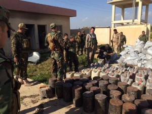Kurdish Peshmerga fighters show off IEDs found in recovered territory taken back from ISIS fighters near Kirkuk. Bill Neely