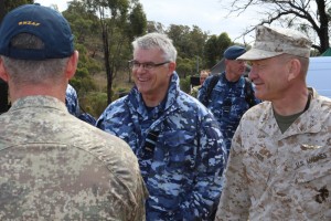 Air Commander Australia, Air Vice Marshal Gavin Turnbull (centre), AM, chats with other exercise participants including Lieutenant General Jon Davis (right), Deputy Commandant for Aviation, United States Marine Corps, at Exercise Jericho Dawn 2016 firepower demonstration at Puckapunyal training area, Victoria, on 18 March 2016. *** Local Caption *** The Royal Australian Air Force (RAAF) and Australian Army, with support from Northrop Grumman, have successfully conducted a firepower demonstration and a combat team quick attack demonstration at Puckapunyal Military Area as part of Exercise Jericho Dawn to display the powerful effects of integrated air and land operations. The live fire exercise allowed RAAF and Army operators, together with Defence and Industry representatives, to observe the combined air and land capabilities in two scenarios. The operators demonstrated the current capabilities, before trialling new ways to improve air-land integration, including the way that aircraft and vehicles connect and translate information through different communication networks.