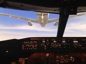 P-8 crew flying the Wedgetail simulator in Australia for refueling operations.