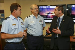 Nextgen Cyber Innovation and Technology Centre (NCITC) Operations Manager, Mr Merv Wills (right), talks to Program Manager - Joint Strike Fighter, Air Vice-Marshal Chris Deeble, AM, CSC (centre) and Director General Capability Planning, Air Commodore Mike Kitcher, OAM (left) about the NCITC at Lockheed Martin. *** Local Caption *** On the 2nd of December 2014 Lockheed Martin Australia hosted an event to launch the first F-35 Joint Strike Fighter (JSF) Autonomic Logistics Information System (ALIS) simulation environment. Through ALIS, Lockheed Martin provides performance based logistics for the entire global fleet of F-35 aircraft. ALIS integrates a range of capabilities which include operations, maintenance, supply chain, customer support, technical data and training. The ALIS simulation environment will support integration activities and testing within the Defence environment prior to the first F-35 JSF arriving into Australia in 2018.