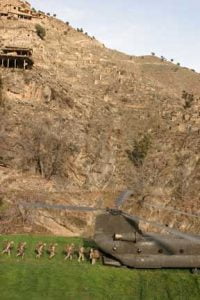 KORANGAL VALLEY, Afghanistan. 3rd Battalion Marines and sailors dash for a waiting CH-47 Chinook helicopter during the extraction phase of Operation Cornhuskers early 2005.The Marines used a vertical envelopment strategy to gain access to areaswhere coming in ground vehicles or on foot would give away their element of surprise.Credit: USMC, Cpl. Rich Mattingly, March 2005