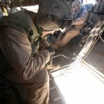 Marine guides a CH-53E Super Stallion pilot 