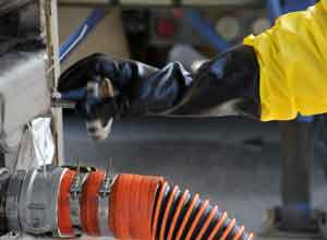 Ohio - U.S. Air Force Master. Sgt Paul Tatar, a C-130 Hercules aircraft aerial spray aircraft maintainers, from the 910th Aircraft Maintenance Squadron at Youngstown-Warren Air Reserve Station, Ohio,  refill a C-130 with oil-dispersing chemicals on the runway of the Stennis International Airport, Miss, on May 9, 2010. Members of the 910th Airlift Wing (AW) are in Mississippi to assist with the Deepwater Horizon oil spill. The 910th AW specializes in aerial spray and is the Department of Defense’s only large-area fixed-wing aerial spray unit.