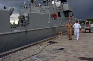 Figure 2 Rear Adm. Jeffery "Scott" Jones, director, Coalition Naval Advisory Transition Team Mission (left) and Commodore Muneer Saddam from the Iraqi navy, walk alongside the 35-meter patrol boat that Iraqi sailors are being trained to operate and maintain. The Iraqi navy will take possession of the boat in late summer 2010. The training is being coordinated through Naval Education and Training Security Assistance Field Activity, Naval Air Warfare Center Training Systems Division, Naval Sea Systems Command, and Swiftships Shipbuilding (Credit Photo: Naval Education and Training Command, 6/16/10) (Figure 2 Rear Adm. Jeffery "Scott" Jones, director, Coalition Naval Advisory Transition Team Mission (left) and Commodore Muneer Saddam from the Iraqi navy, walk alongside the 35-meter patrol boat that Iraqi sailors are being trained to operate and maintain. The Iraqi navy will take possession of the boat in late summer 2010. The training is being coordinated through Naval Education and Training Security Assistance Field Activity, Naval Air Warfare Center Training Systems Division, Naval Sea Systems Command, and Swiftships Shipbuilding. Credit Photo: Naval Education and Training Command, 6/16/10)