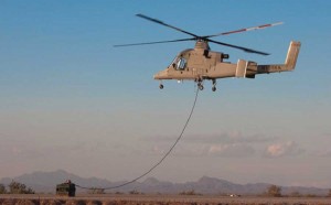 A CH-53E "Super Stallion" helicopter from Marine Heavy Helicopter Squadron 466, Marine Aircraft Group 40, Marine Expeditionary Brigade-Afghanistan, settles over two pallets of water to hook onto the cargo and transport it to Marines operating in remote areas of southern Afghanistan, January 29, 2010. The squadron ended up moving more than 58,000 pounds of water in just a few hours. (Credit Photo: USMC)