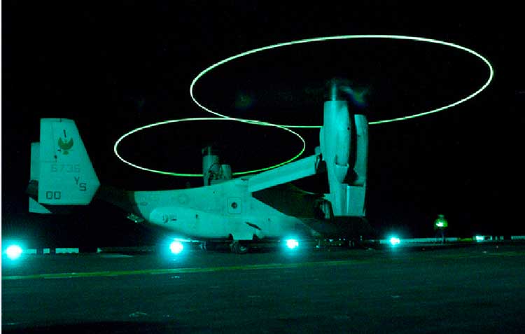 An MV-22B Osprey assigned to Marine Medium Tiltrotor Squadron (VMM) 162 prepares to take off from the amphibious assault ship USS Nassau (LHA 4). Nassau is the command platform for the Nassau Amphibious Ready Group supporting maritime security operations and theater security cooperation operations in the U.S. 5th Fleet area of responsibility. (Credit photo: USN Visual Service)